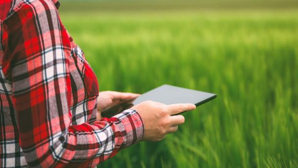 Rural image of a women holding a tablet