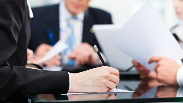 Person signing a contract