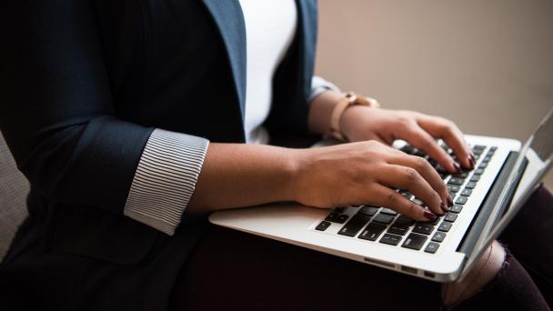 Person typing on a laptop